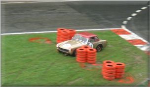 Ian Wright squeezing through the tyres